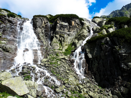 Skok waterfall, High Tatras mountains in Slovakia on a summer day.の写真素材