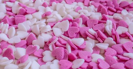 Pink and white candy hearts background.