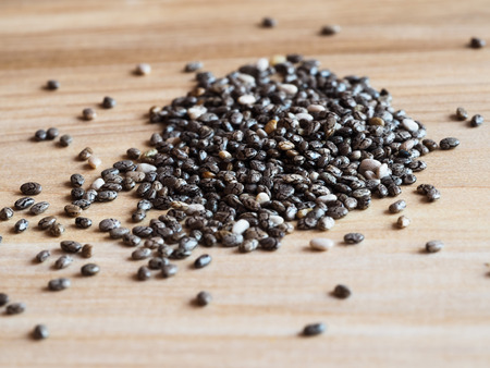 Chia seeds - close up on a wooden backgroundの写真素材