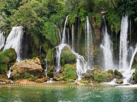 Beautiful Kravica waterfall in Bosnia and Herzegovina - popular swimming and picnic area for touristsの写真素材