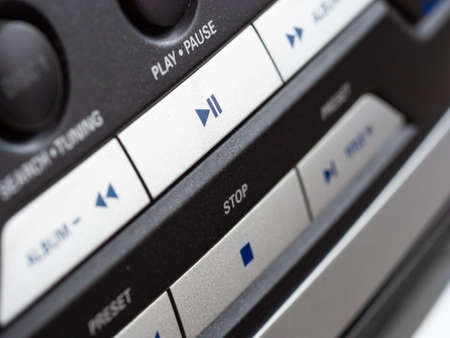 Close up of audio control buttons of music player, detail stop, play