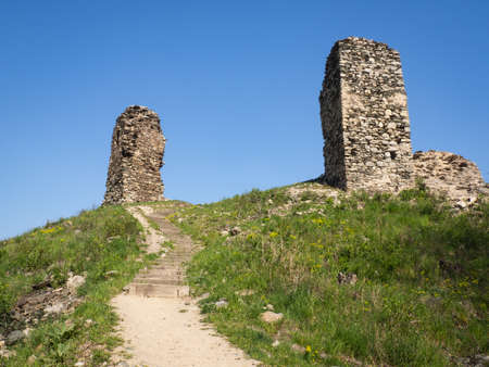 Ruins of ancient gothic castle Brnicko, Czech Republic, Europe. Old ruin with green grass and blue...