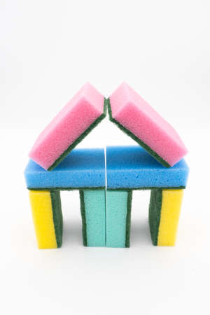 Colorful cleaning sponges, shape of a house on white backgroundの写真素材