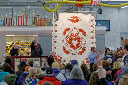GORDONVILLE PENNSYLVANIA - March 11, 2017: Amish volunteers help at the annual quilt auction which benefits the Fire Company.のeditorial素材