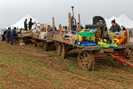 PENRYN PENNSYLVANIA - MARCH 18, 2017: A rainy muddy day at the annual "Amish Mud Sale" to benefit Penryn Fire Co.#1 and Limerock Parochial School. Sale items include quilts, tools, food, crafts, farm machinery and antiques.のeditorial素材