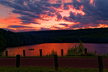 A cloudy sunset at Locust Lake State Park, Schuylkill County, Pennsylvania, USA.の写真素材