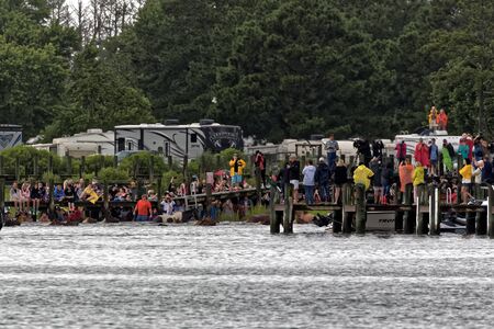 CHINCOTEAGUE, VIRGINIA - JULY 25, 2018: Wild ponies swim to Chincoteague Island from Assateague Island. This is an annual event to raise money for the  Volunteer Fire Company.のeditorial素材