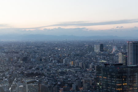 TOKYO, JAPAN - FEBRUARY 17: Shinjuku district view through glass from Tokyo Metropolitan Government Building observation before sunset February 17, 2017 in Tokyo, Japanのeditorial素材