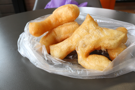 Patongko (White dough deep fried) on plastic bag Thai style