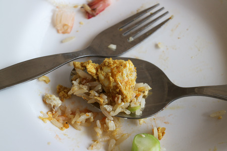 closeup stir fried crab with egg and curry powder with rice on spoonの写真素材