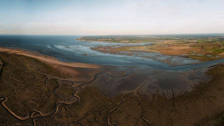 The baie des Veys in Normandy, France. Aerial view the meanders of the Vire river along the English Channel coastlineの写真素材