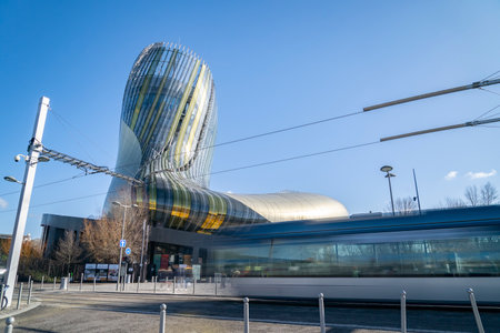 The Cite du vin in Bordeaux France during the daytime with the tramway in the foregroundのeditorial素材