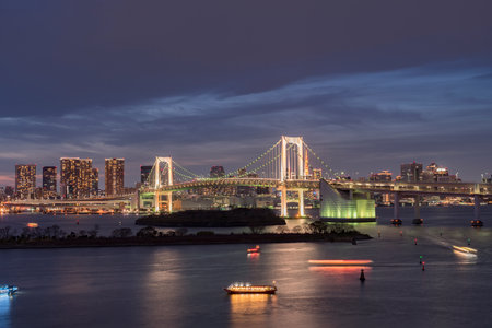 The iconic Rainbow Bridge neighbourhood in Tokyo, Japan during a warm Sunsetの写真素材