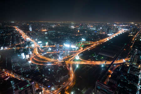 The city skyline of Bangkok Thailand and the city traffic at night. Taken from the Baiyoke Tower 2