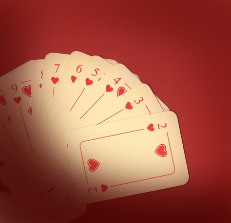 Playing cards on red background