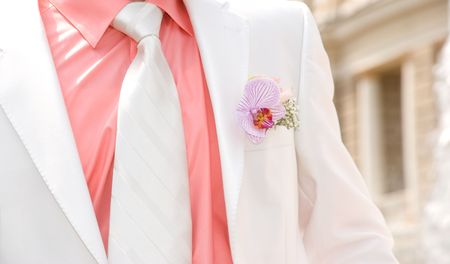 Wedding orchid on lapel of maleの写真素材