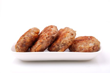 Cutlets in a plate isolated on whiteの写真素材