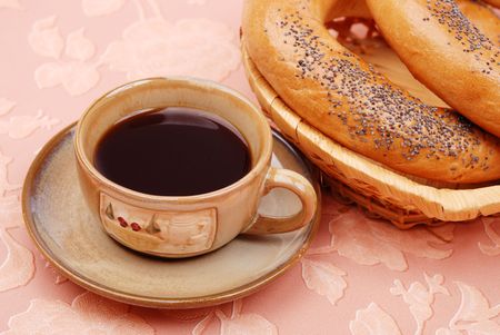 Cup of coffee with a bagelsの写真素材