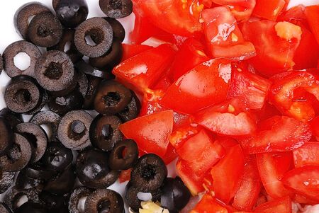 background from crushed olives and tomatoの写真素材