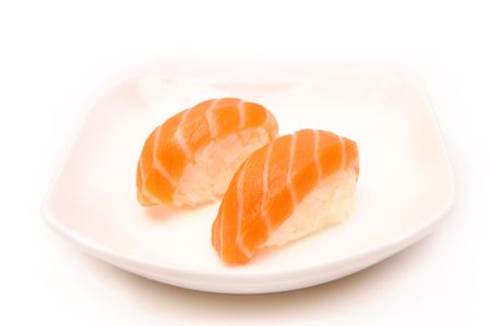 sushi with a salmon on white plateの写真素材