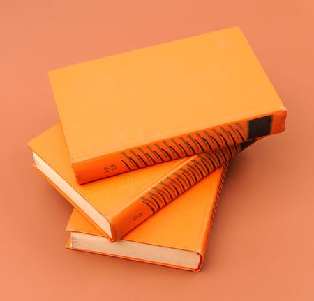 books stack on brown backgroundの写真素材