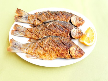 roasted fish with lemonの写真素材