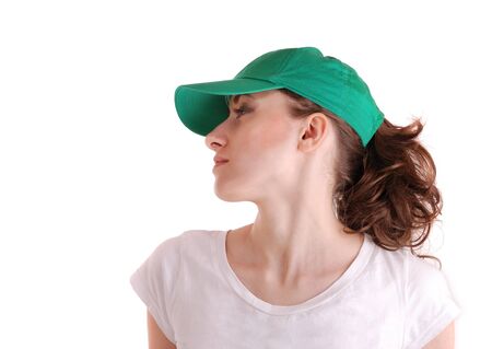 profile portrait of a young sports cute woman in a capの写真素材