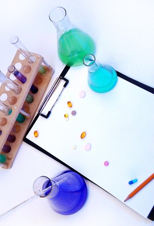 Laboratory research - glass test tubes, tablets and the formの写真素材