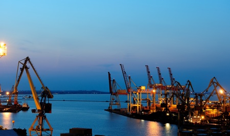View on seaport with cranes at the night.の写真素材