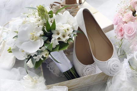 Bridal bouquet and bride shoes.の写真素材