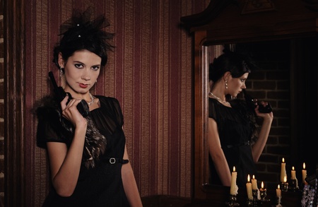Gangster girl portrait with gun and money, picture in retro style. 