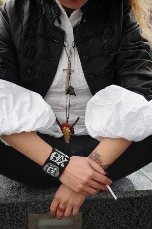 Teenage hands holding cigarette, destroying unhealthy lifestyleの写真素材