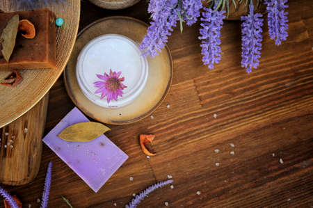 Flat lay artisan cream and soap - bath cosmetics, spa concept, wooden background, copy space for textの写真素材