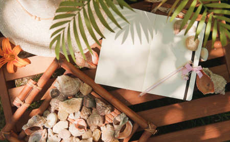 Mock up with notebook diary, outdoor summer photoの写真素材