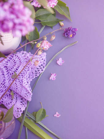 Spring background mockup with empty space gray backdrop with violet flowersの写真素材