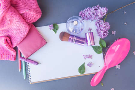Circle perfume bottle, pink hair brush and makeup brush with different flowers, horizontal empty white list template with place for text, flat lay viewの写真素材