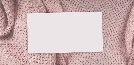 Knitted linen canvas background with empty white business card, fashion banner templateの写真素材