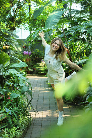 Happy leisure woman outdoor in a tropical gardenの写真素材