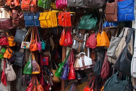 Showcase with bright bags in a storeの写真素材