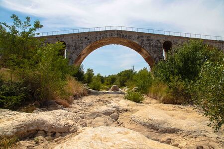 Charming stone bridge across mountain river. France. Provenceの写真素材