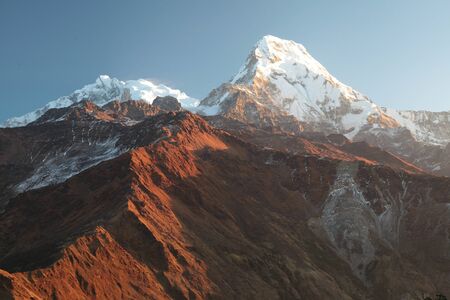Machapuchare mountain in big white clouds. Nepal.