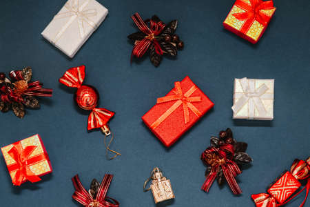 Christmas decorations and gift boxes on the dark blue backgroundの写真素材