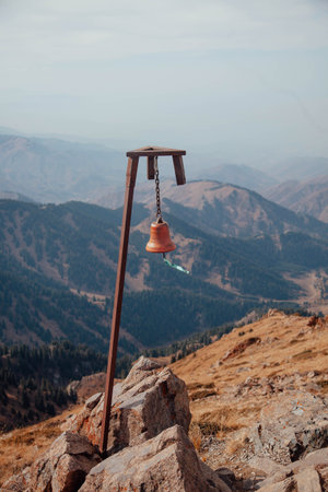 Red bell on the top of Bukreev peak mountain near Almaty in Kazakhstanの写真素材