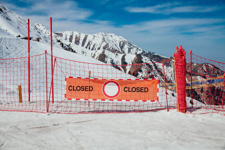 Red banner CLOSED on the ski slope in the mountainsの写真素材