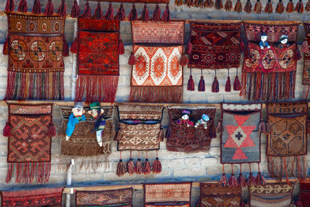 Traditional Uzbek carpets on the wall in a gift shop.