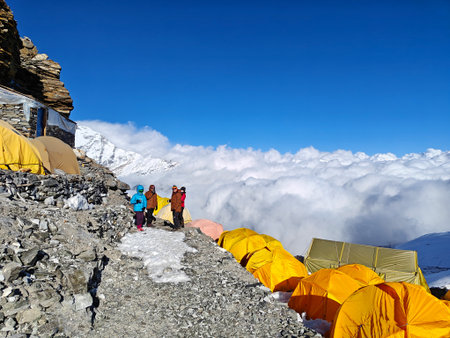 Himalayan mountain camp in Nepal, colorful tents, glacier, and clouds