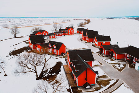 Traditional red wooden houses in snow fairy field
