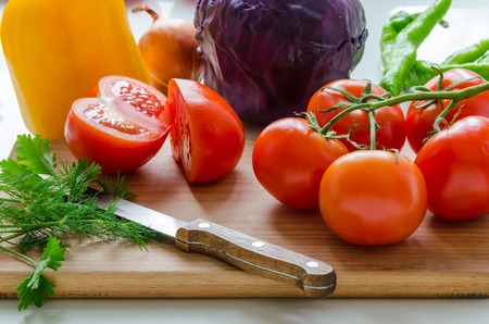 Fresh vegetables lying on a cutting boardの写真素材