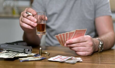 Smoking and drinking during the cards gameのeditorial素材