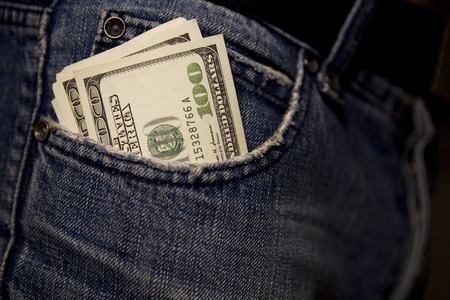money in the front pocket of a jeansの写真素材